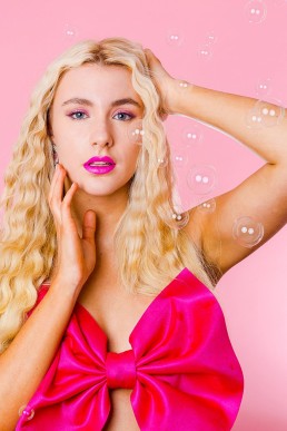 Pink creative beauty shoot with bubbles. Styled editorial photography by Marianne Taylor.