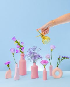 Colourful product photography with floral styling. Styled still life photography by HIYA MARIANNE and Hayley Scott Blooms.