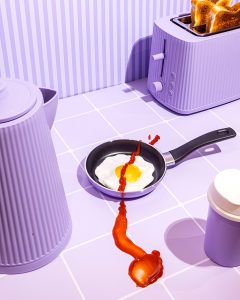 Girl Breakfast. Colourful still life photography in lilac with art direction and styling by HIYA MARIANNE photo production studio.