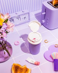 Girl Breakfast. Colourful still life photography in lilac with art direction and styling by HIYA MARIANNE photo production studio.